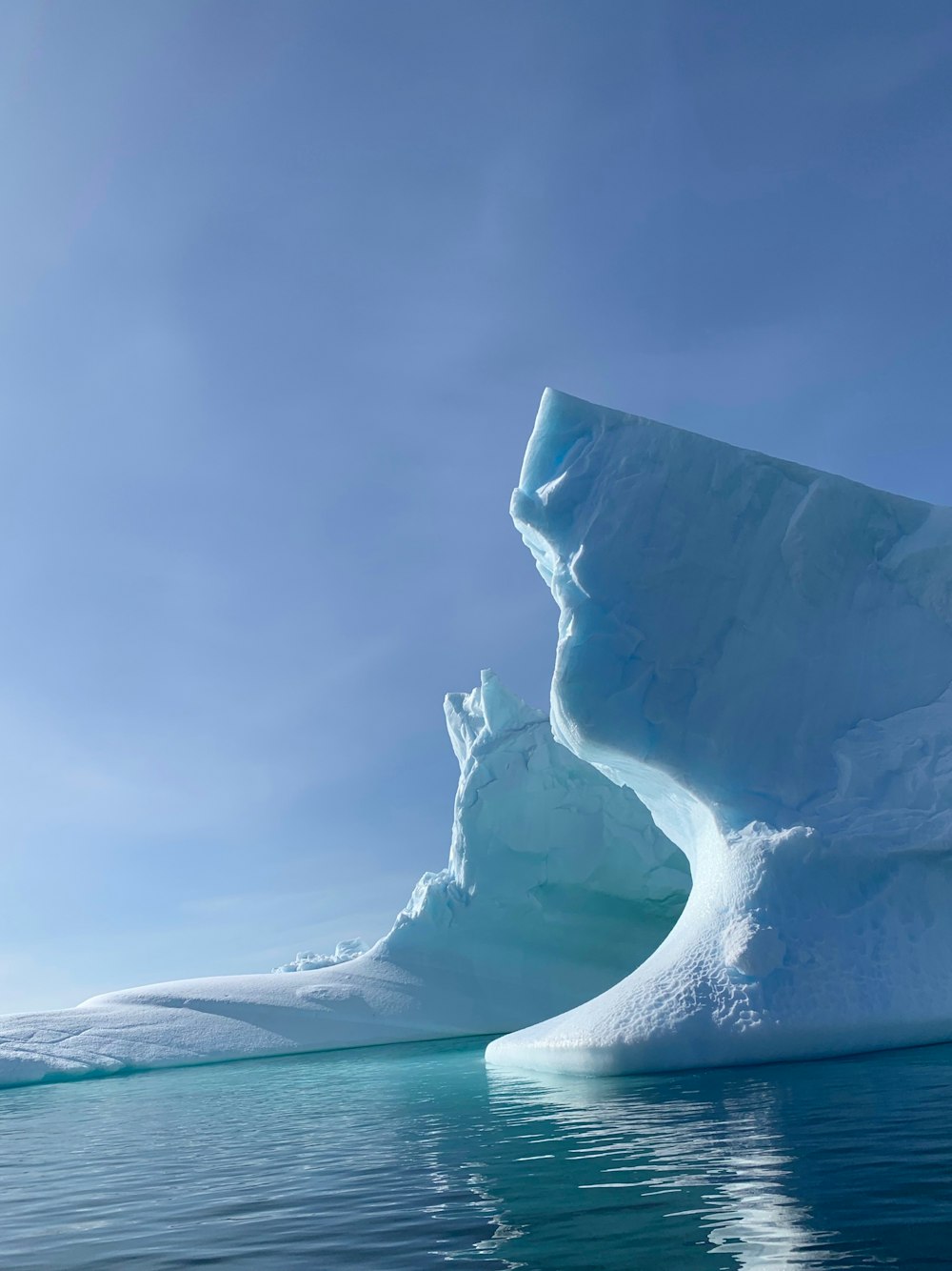 ice formation on body of water during daytime