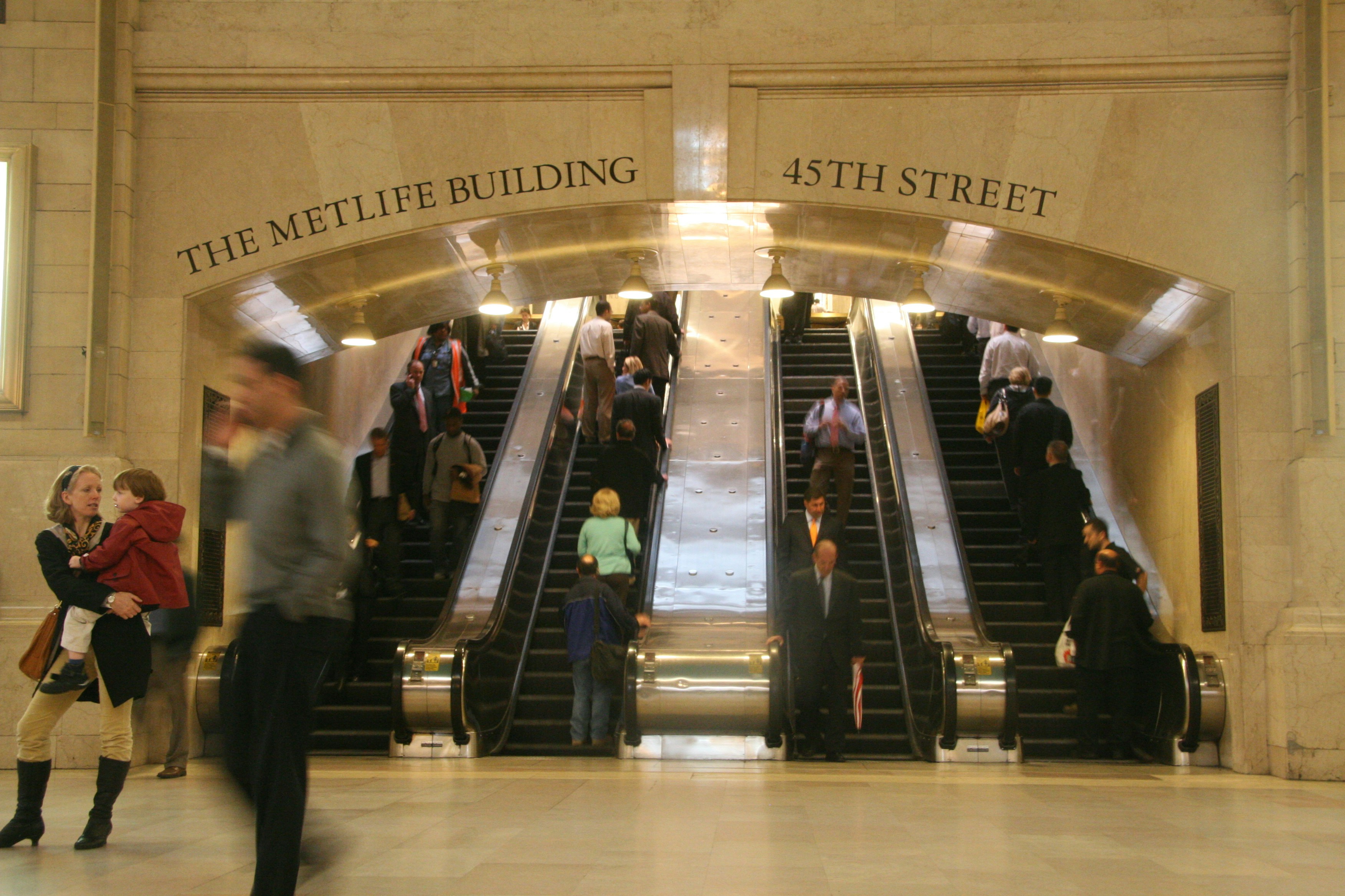 people walking on black and white stadium