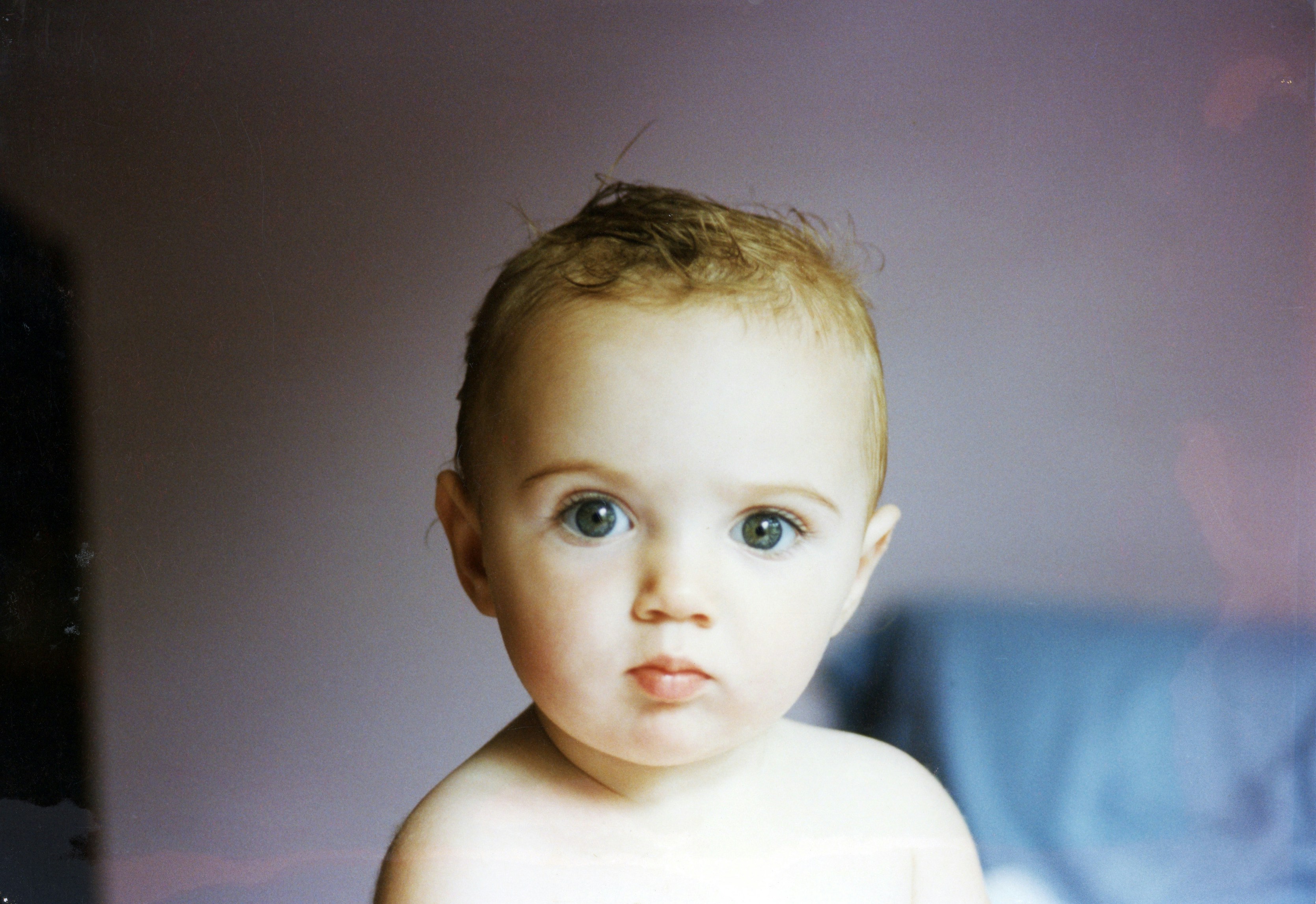 baby in white crew neck shirt