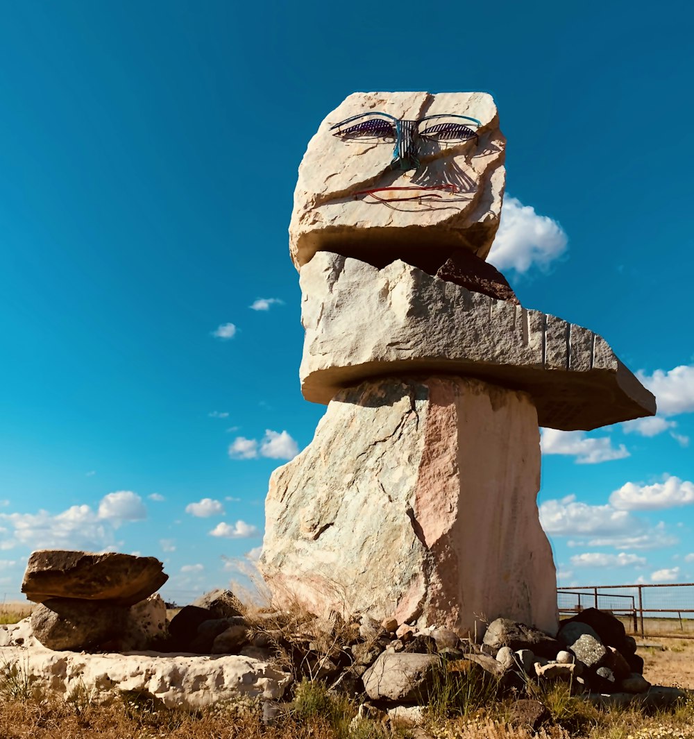 brown rock formation under blue sky during daytime