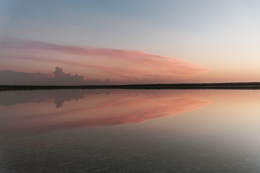 body of water during sunset