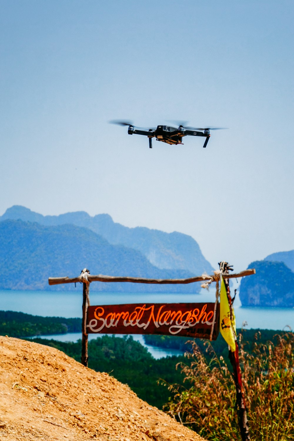 black and white plane flying over the sea during daytime