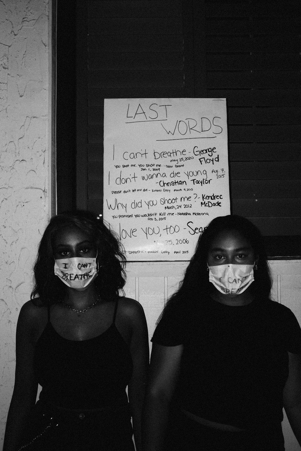 woman in black shirt standing beside woman in black shirt