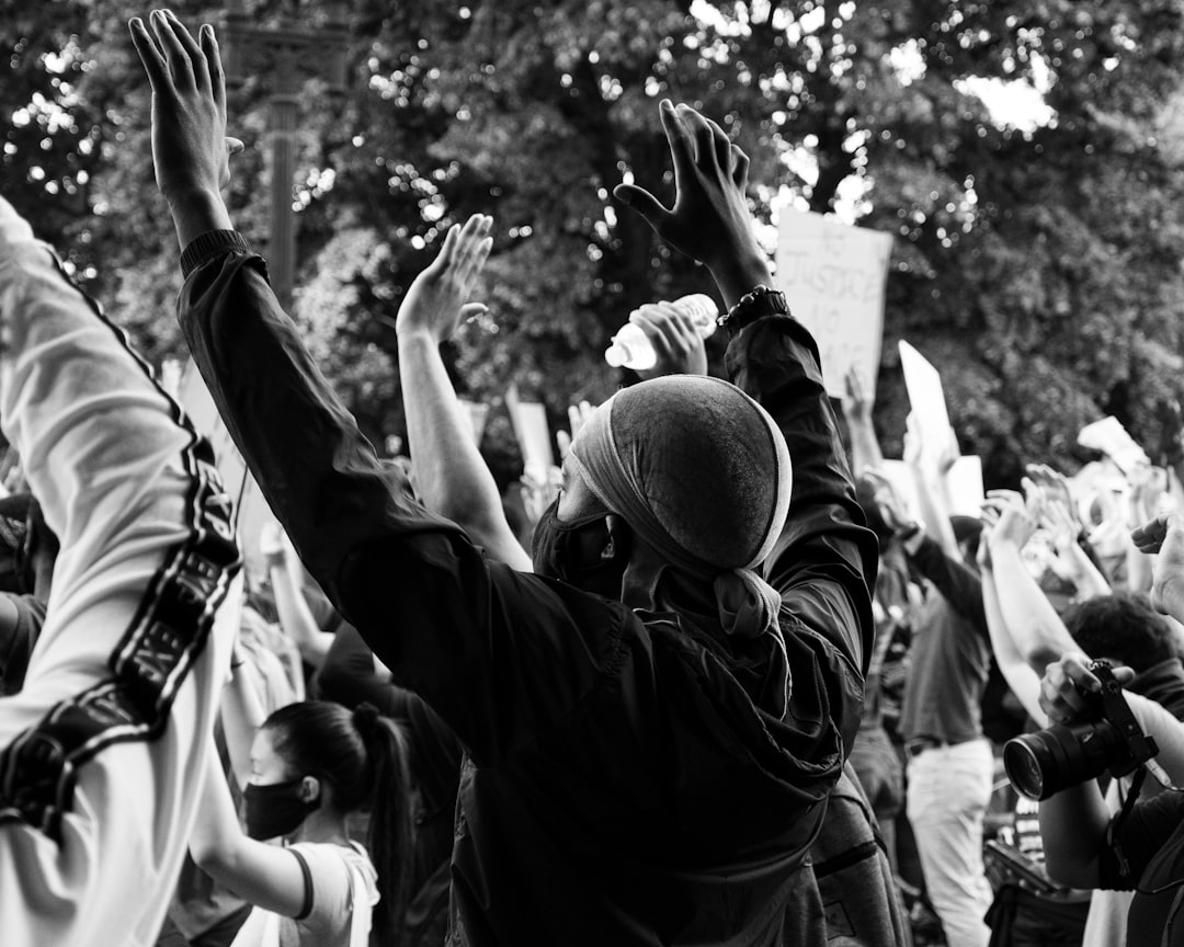 man in black jacket and man in black jacket holding man wearing hat, Black Lives Matter Protest in DC, 6/2/2020.</p></figure><p>(Instagram: @koshuphotography)