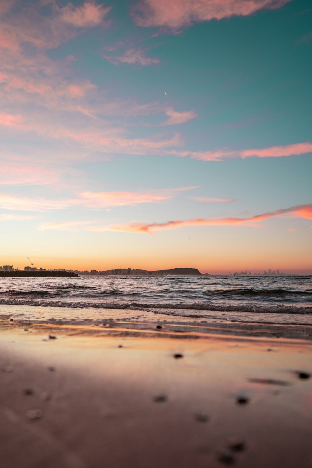 silhouette of people on beach during sunset