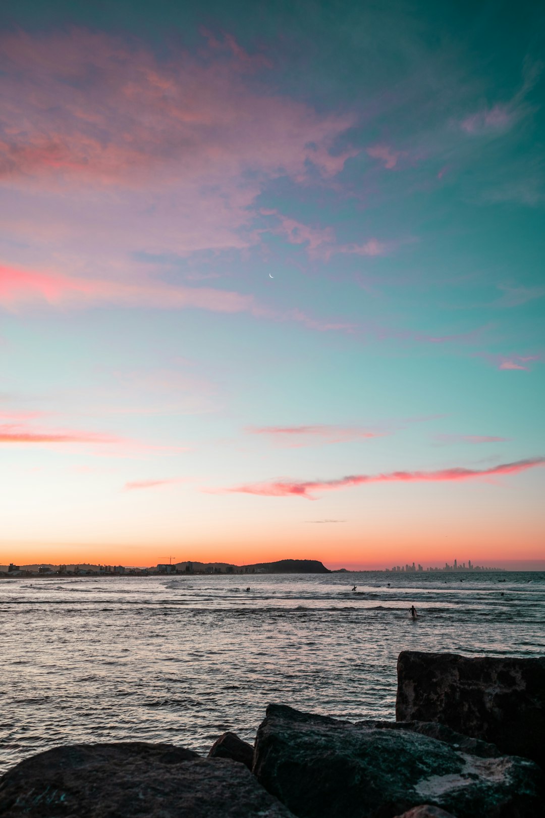 body of water during sunset