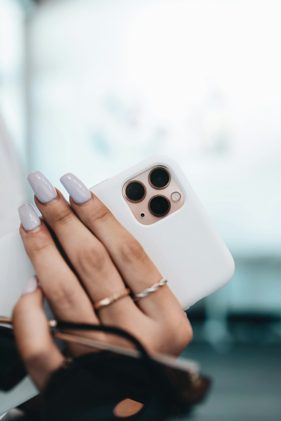 person holding white remote control