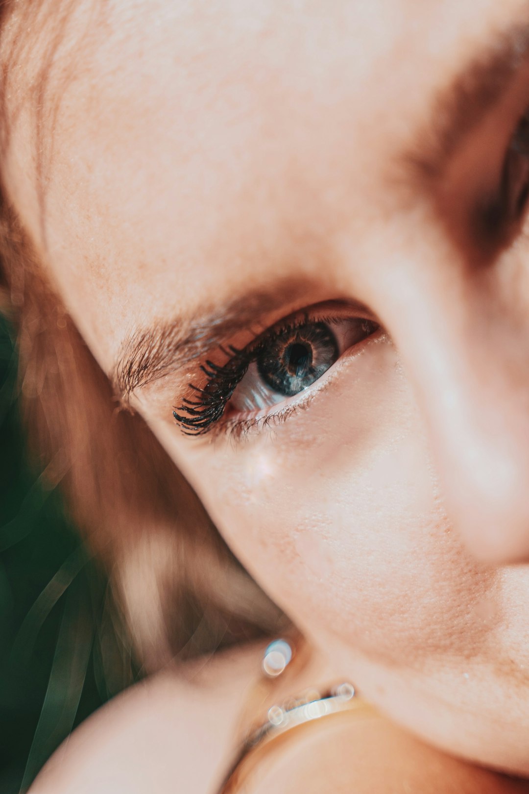 woman with brown hair and green eyes