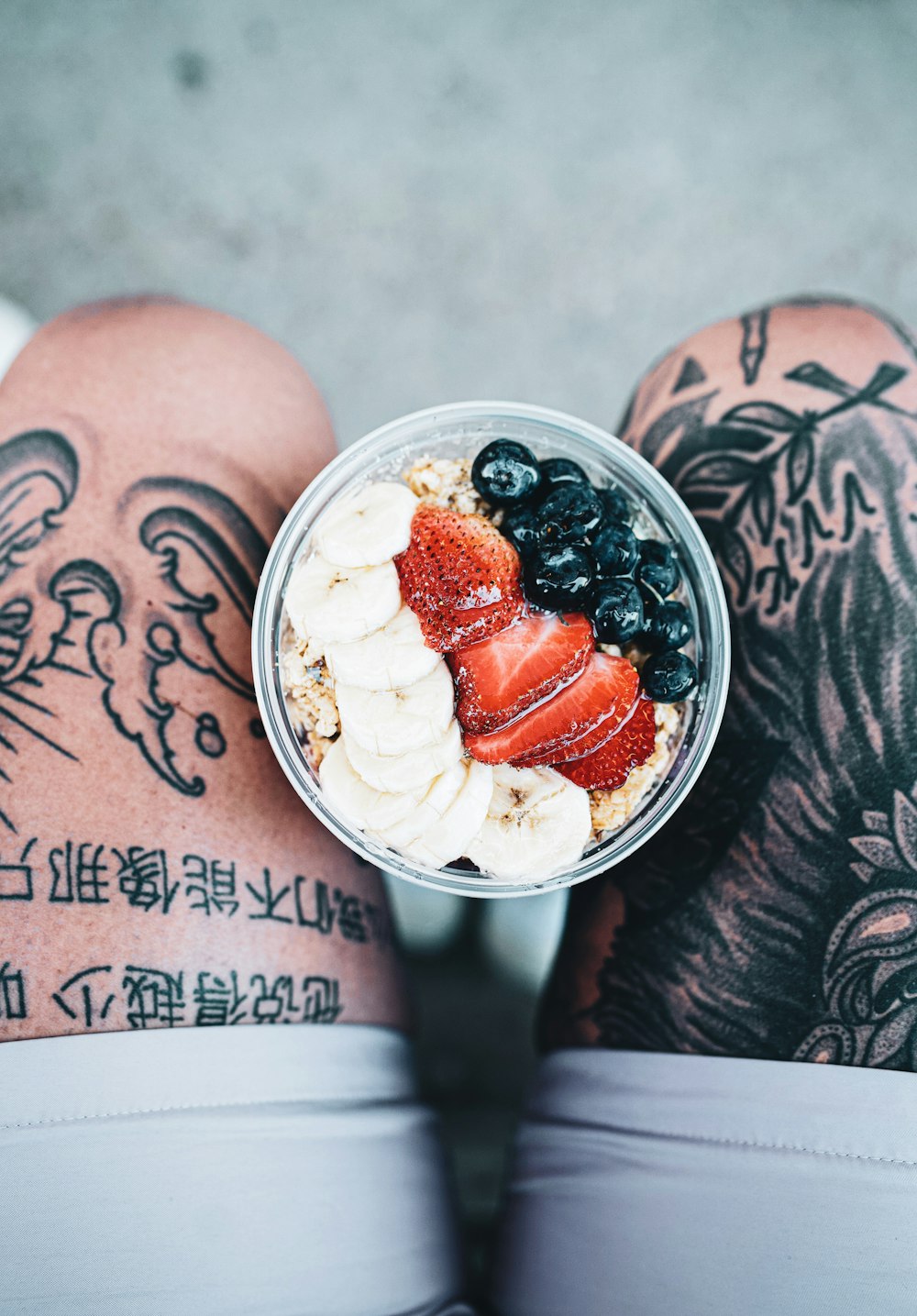 white ice cream with red and black berries on top