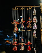 A vibrant set with colorful puppets and a cheerful host engaging with children