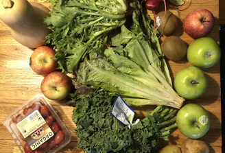 A vibrant assortment of exotic tropical vegetables arranged on a rustic wooden table.