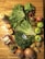Close-up of assorted grocery items neatly arranged on a wooden table.