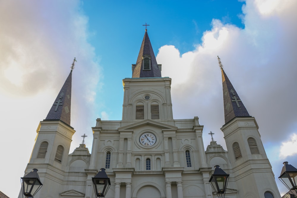 white and brown concrete church under blue sky during daytime