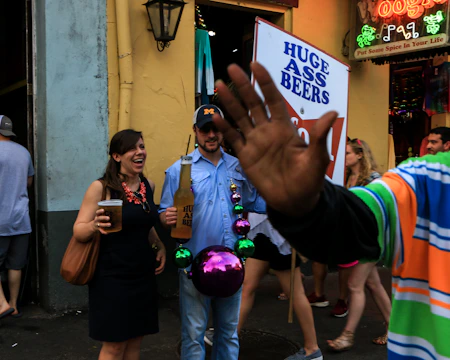 A lively group riding a colorful beer bike through Hamburg streets, laughing and enjoying drinks