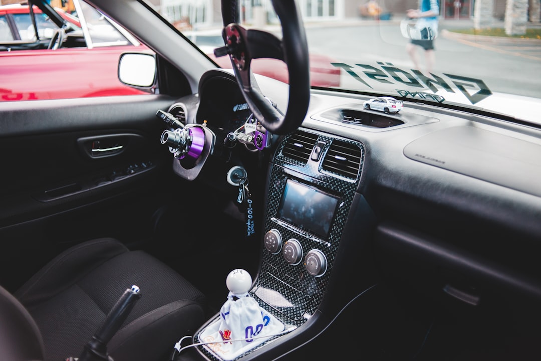 black steering wheel with water droplets