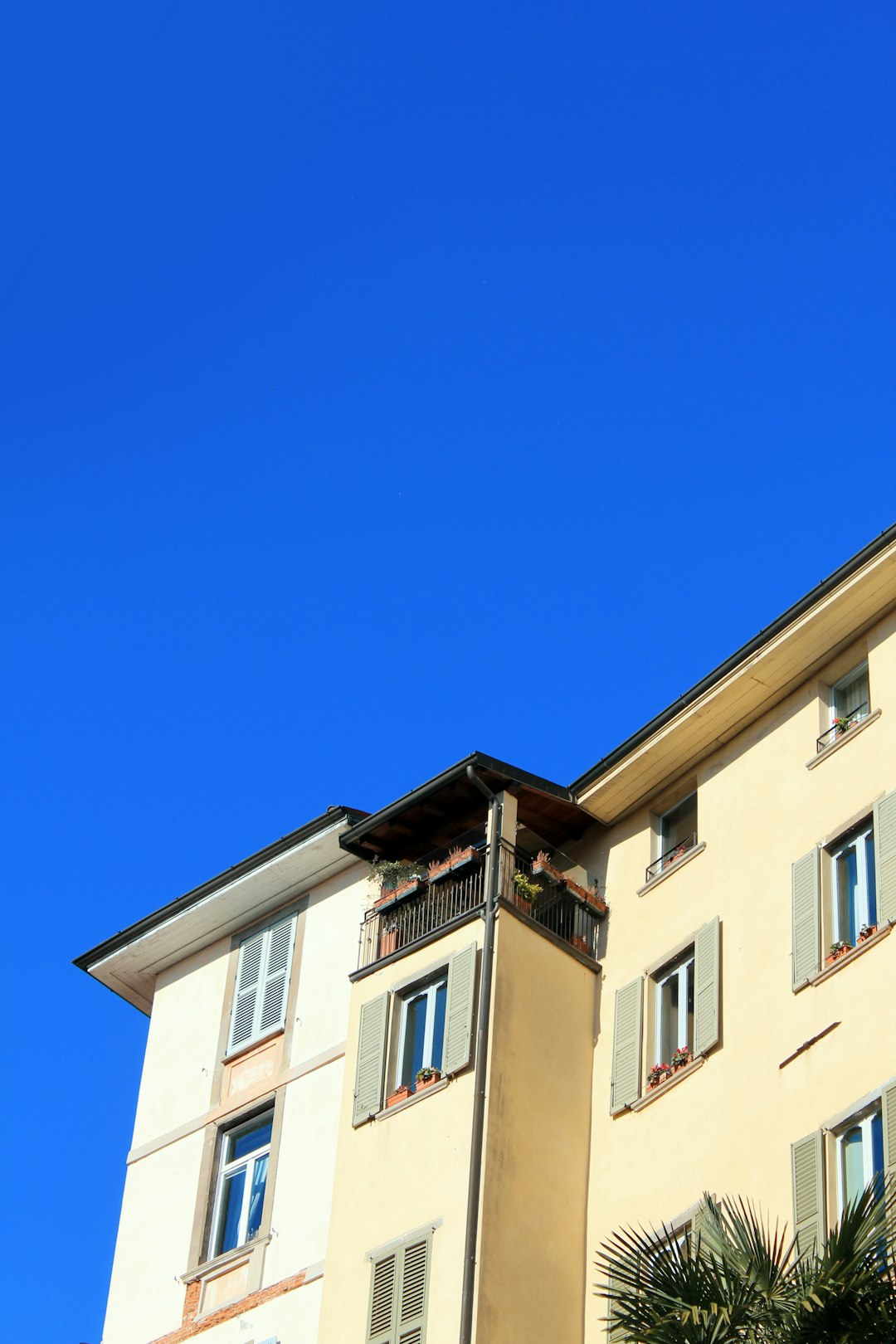 beige concrete building under blue sky during daytime