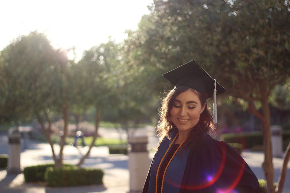 woman in academic dress smiling