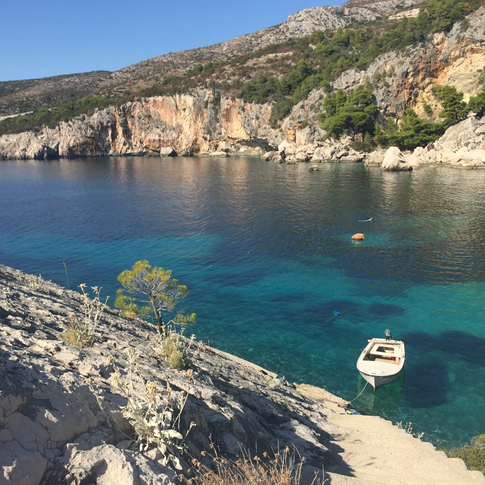 white yacht on blue sea during daytime