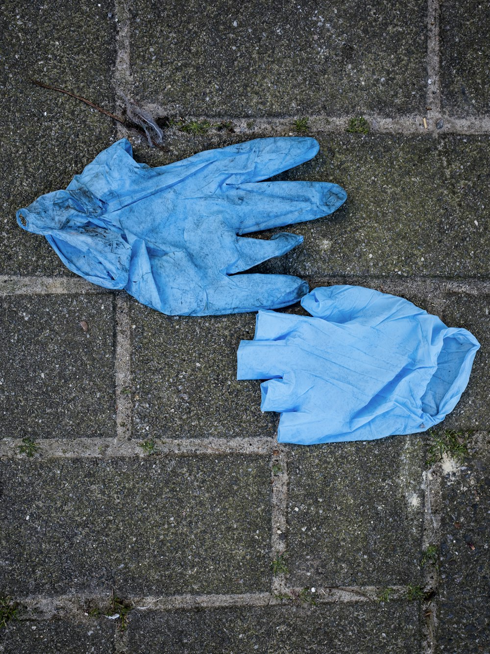 blue gloves on gray concrete floor