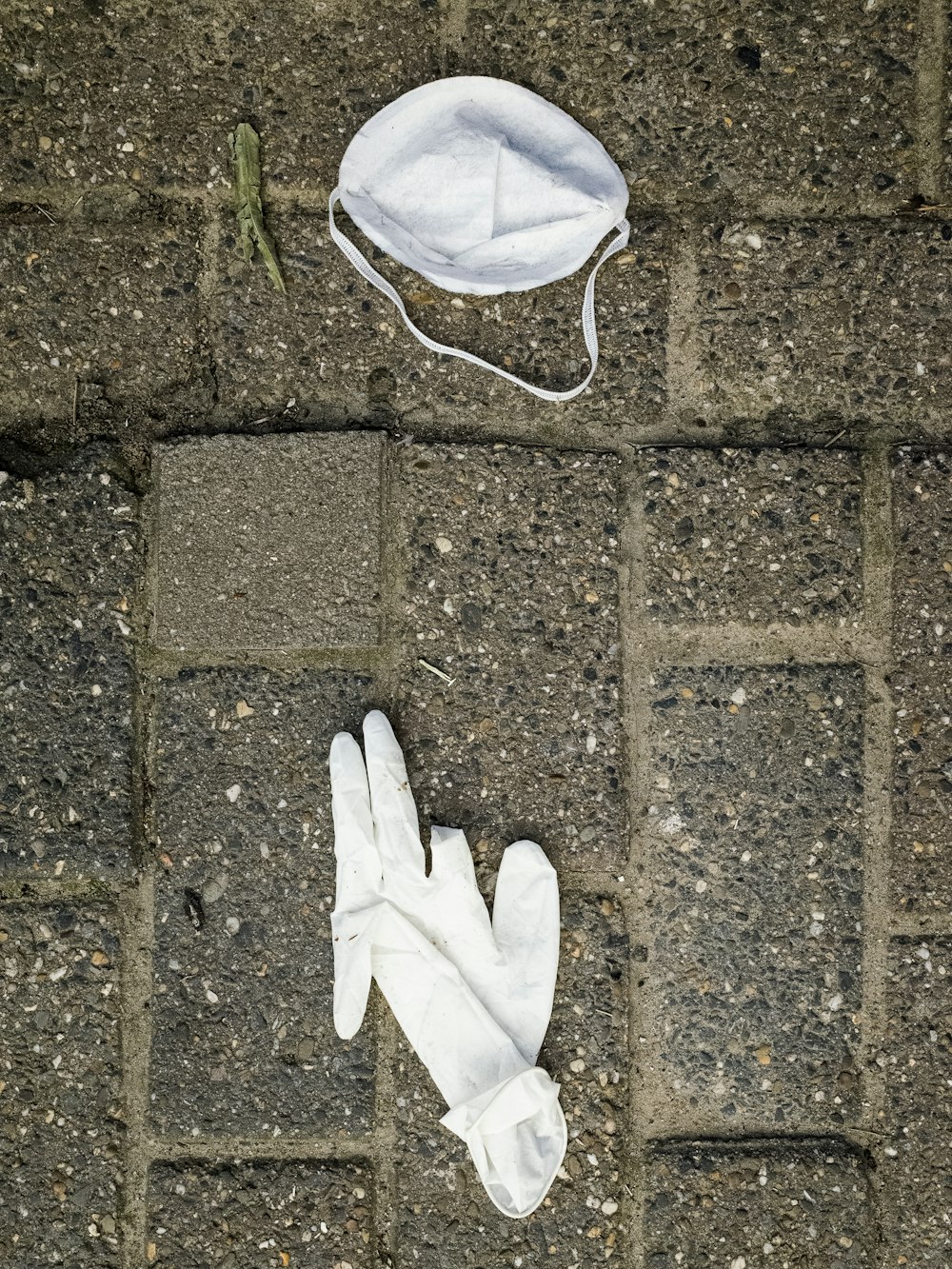 white textile on brown brick floor