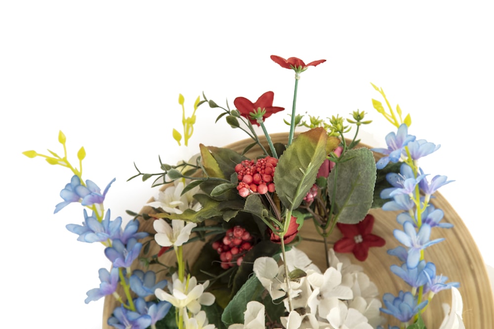 red and white flowers on brown wooden table