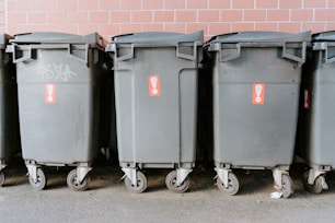 black garbage bins on sidewalk