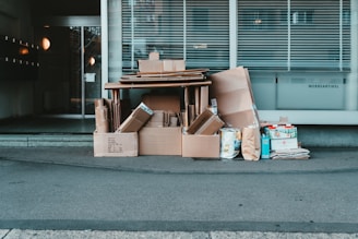 brown cardboard boxes on gray concrete floor