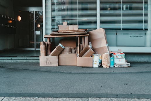 brown cardboard boxes on gray concrete floor