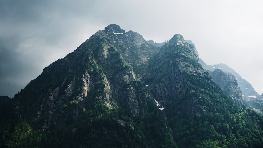 green and gray mountain under white sky during daytime