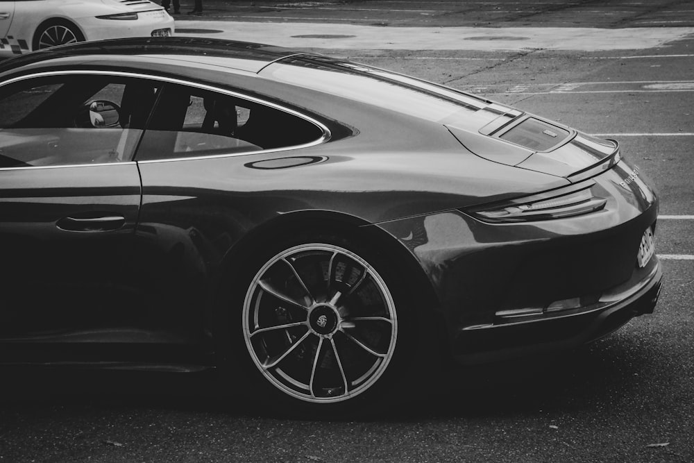 grayscale photo of sports car