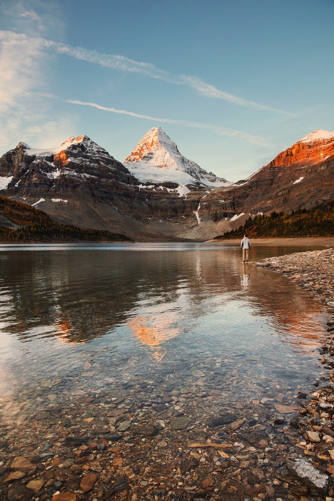 brown and white mountains near body of water during daytime