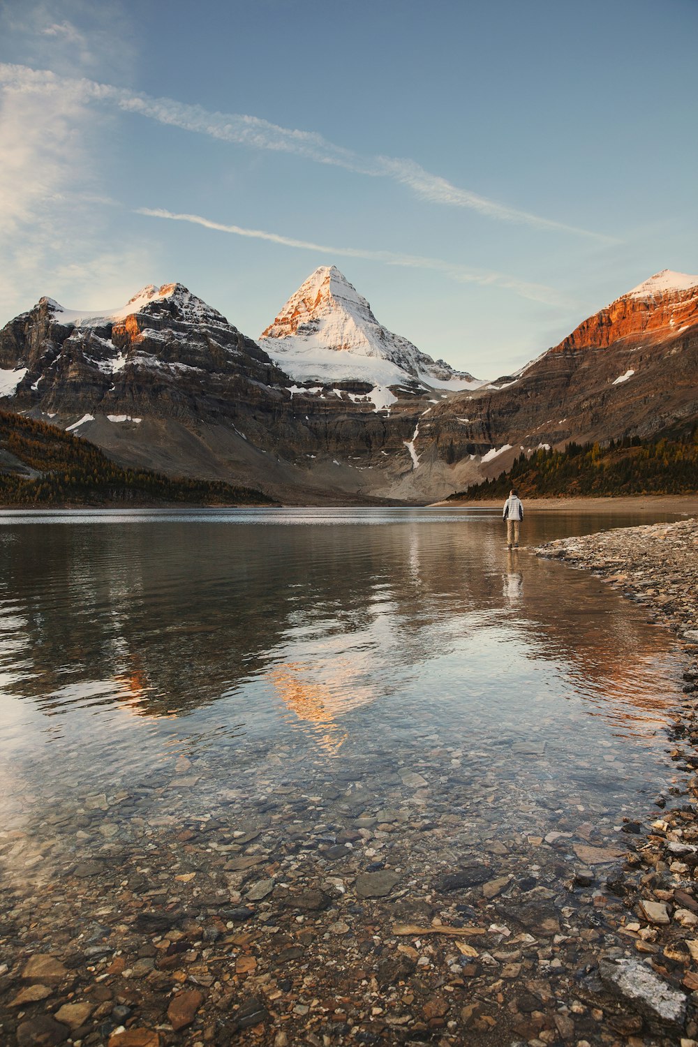 brown and white mountains near body of water during daytime