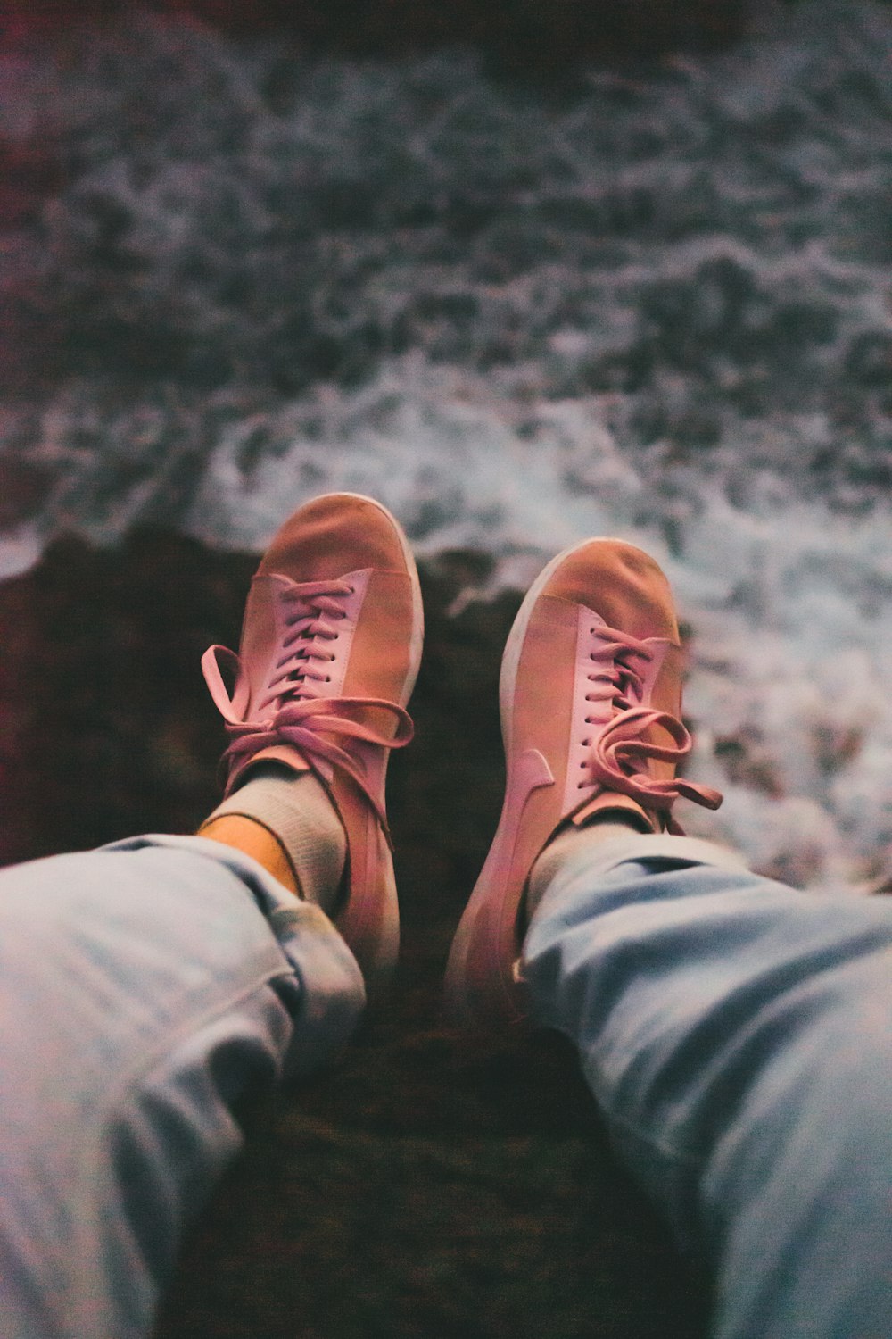 person in gray pants and brown and white sneakers