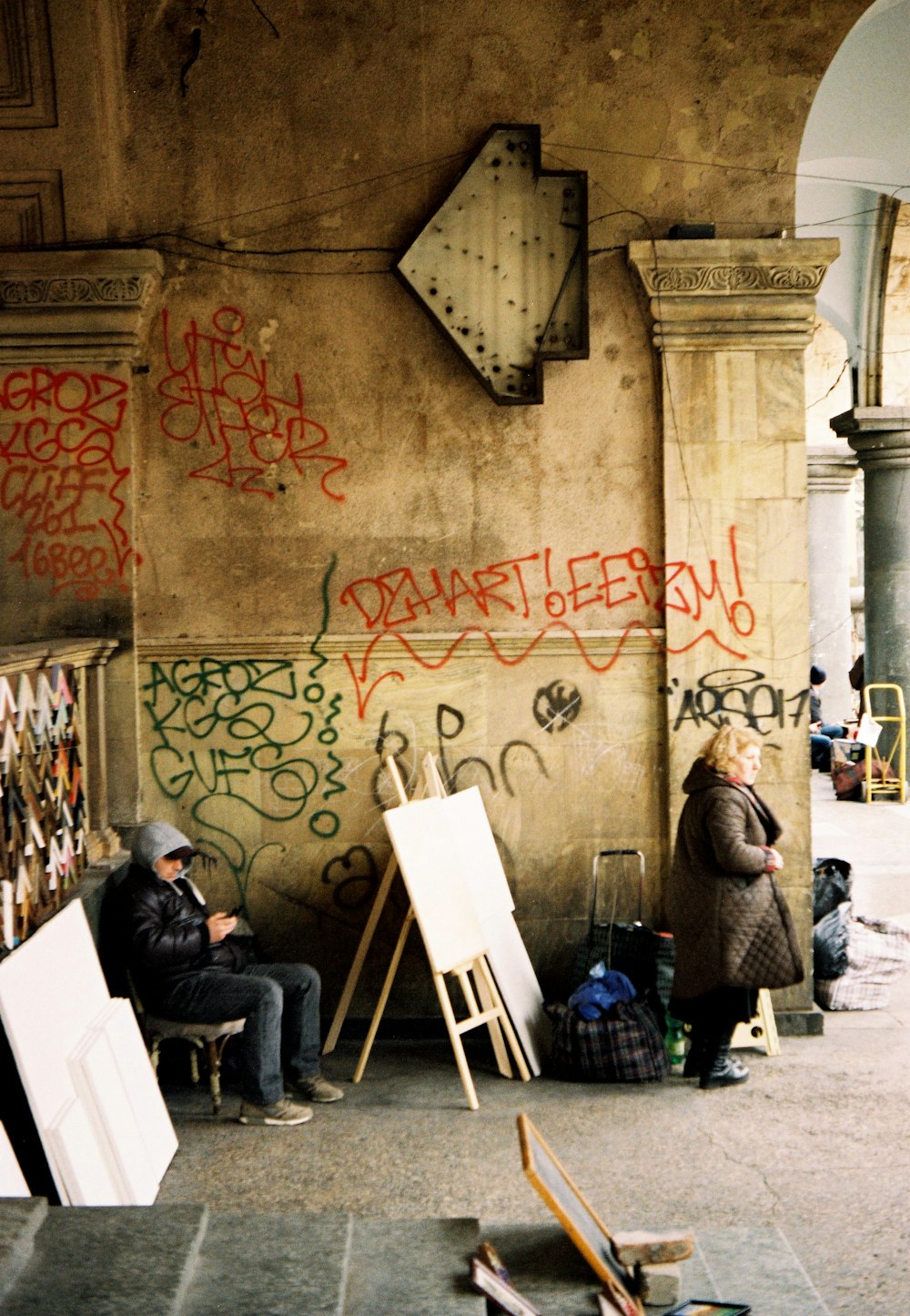 people sitting on white folding chairs