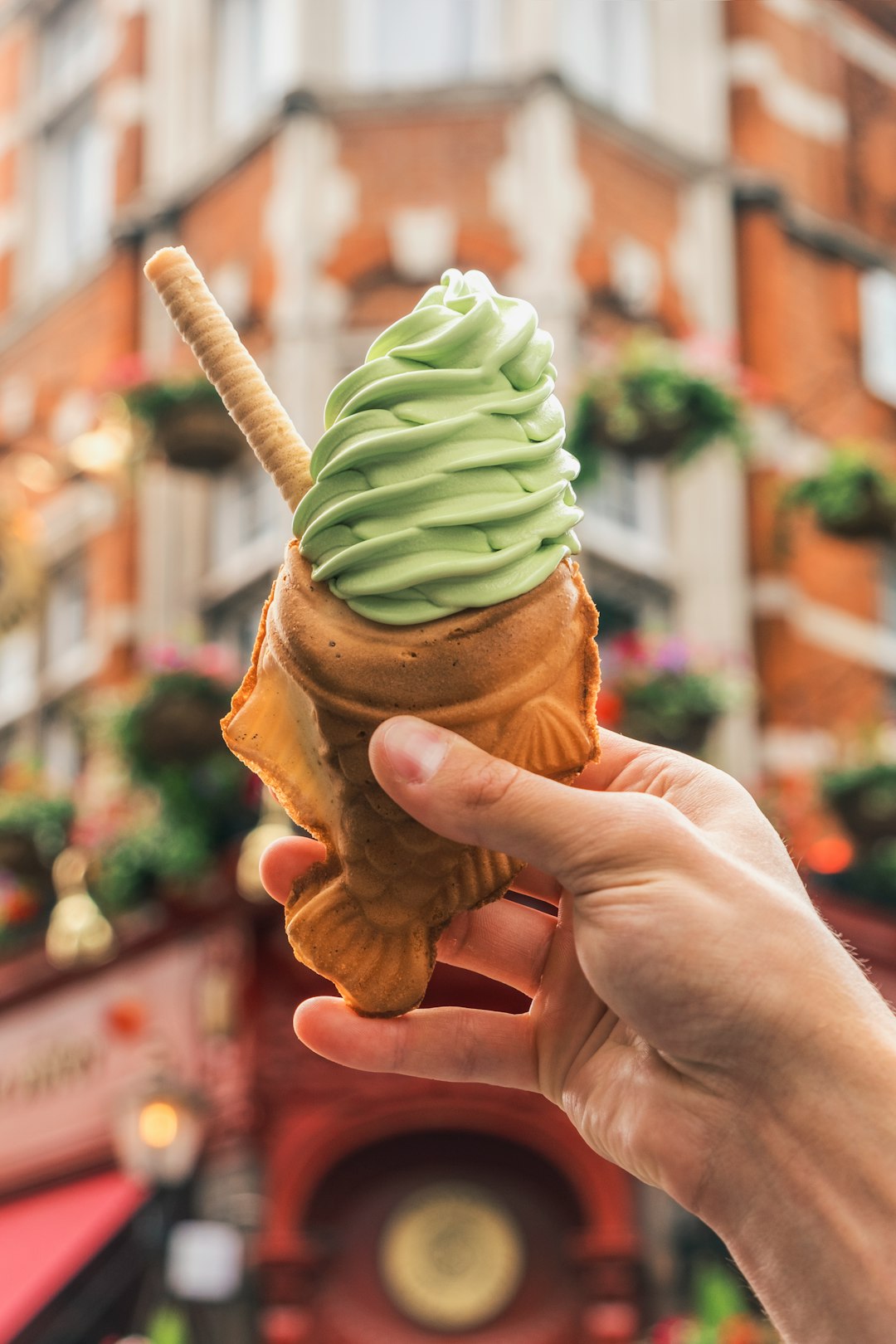 person holding brown ice cream cone