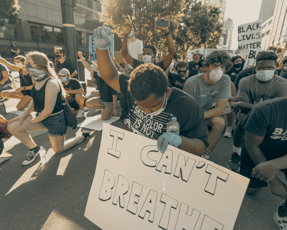 people holding white printer paper during daytime