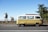 Group of happy travelers enjoying a scenic coastal tour in a comfortable van.