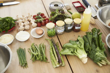 green vegetable on brown wooden table