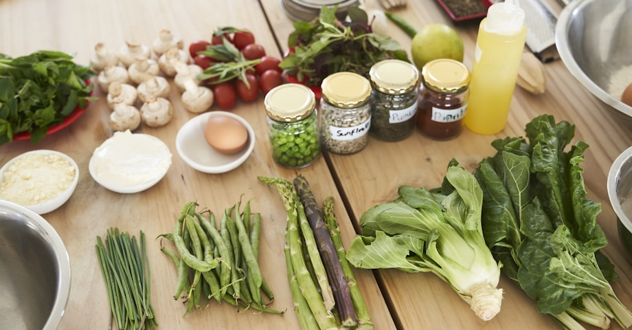 green vegetable on brown wooden table