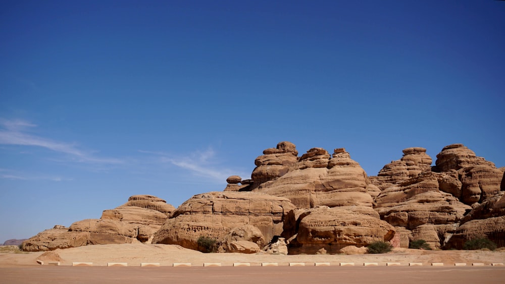 brown rock formation under blue sky during daytime