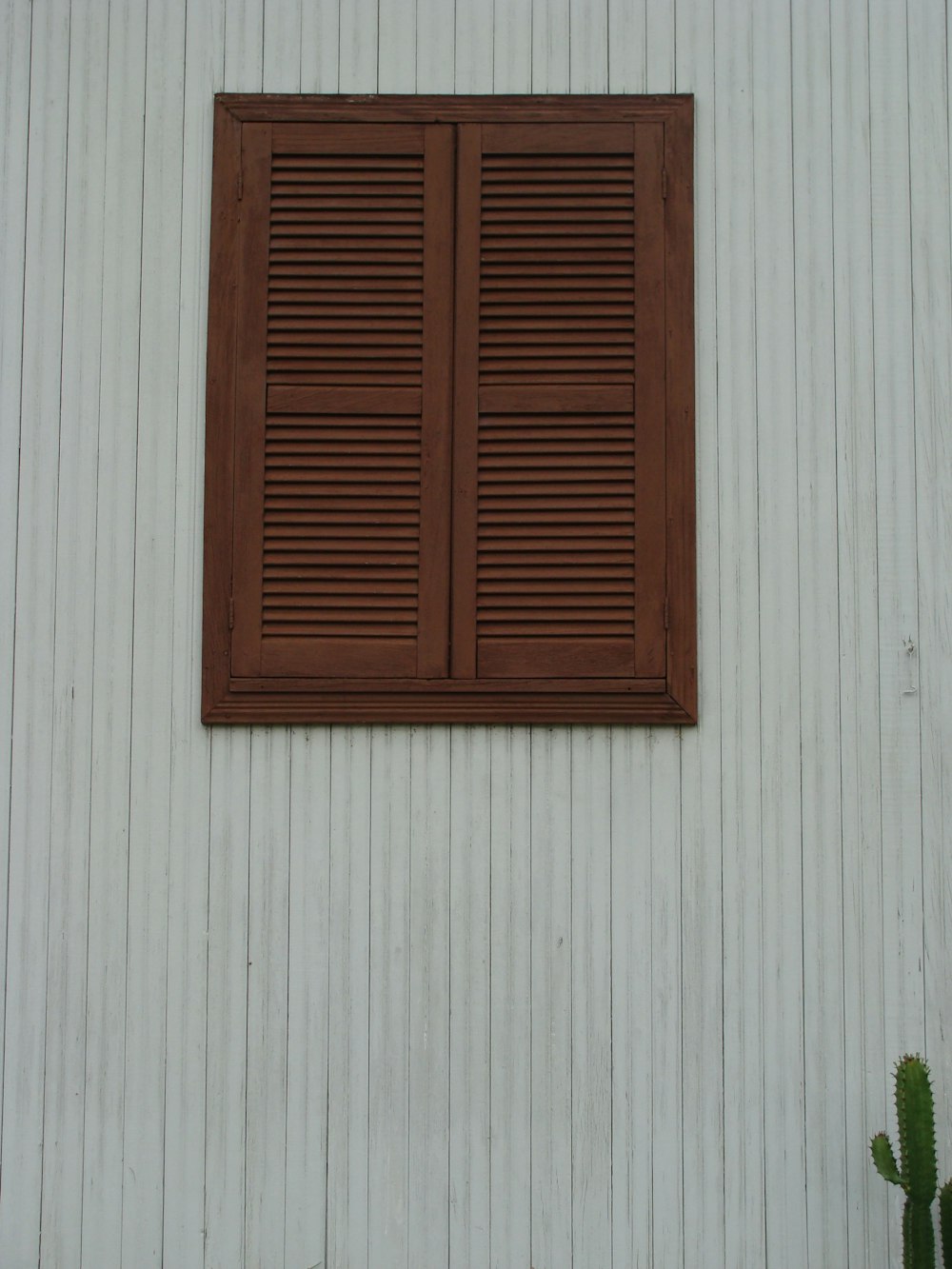 brown wooden window on white wall