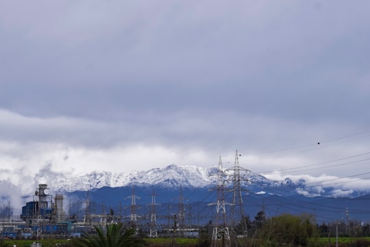 snow covered mountains under white cloudy sky during daytime in Quillota Chile