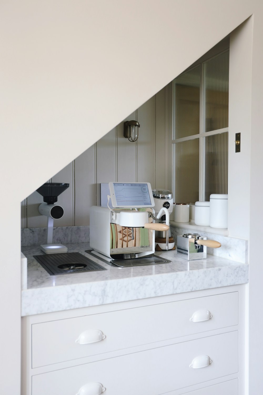 white and black microwave oven on white wooden kitchen cabinet