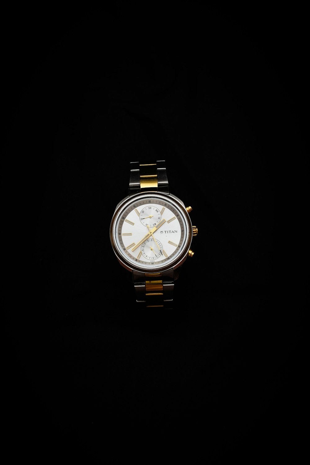 gold and silver analog watch