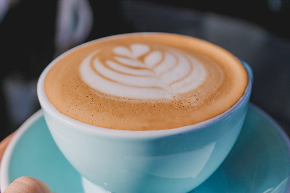 white ceramic cup with brown and white liquid