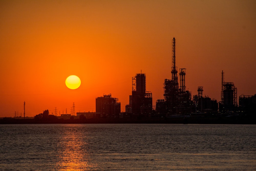 silhouette of city buildings during sunset