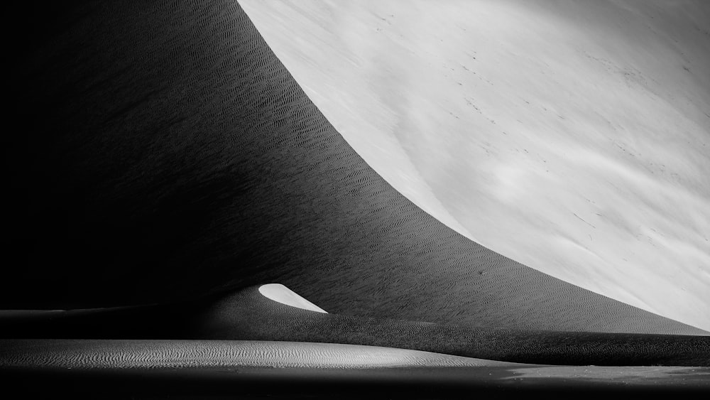 grayscale photo of sand dunes