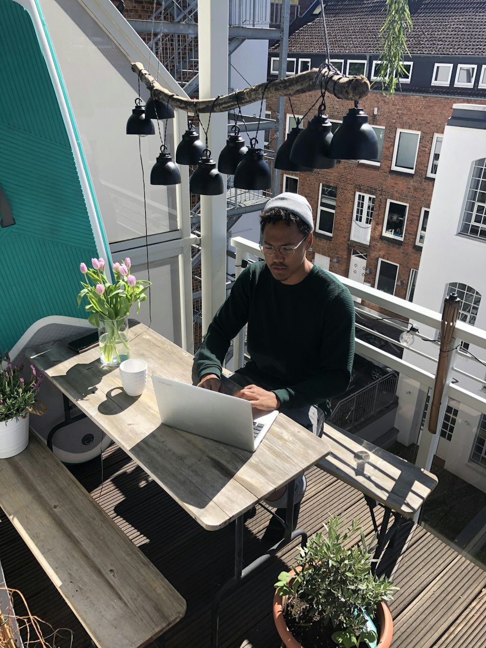 man in black long sleeve shirt sitting on chair