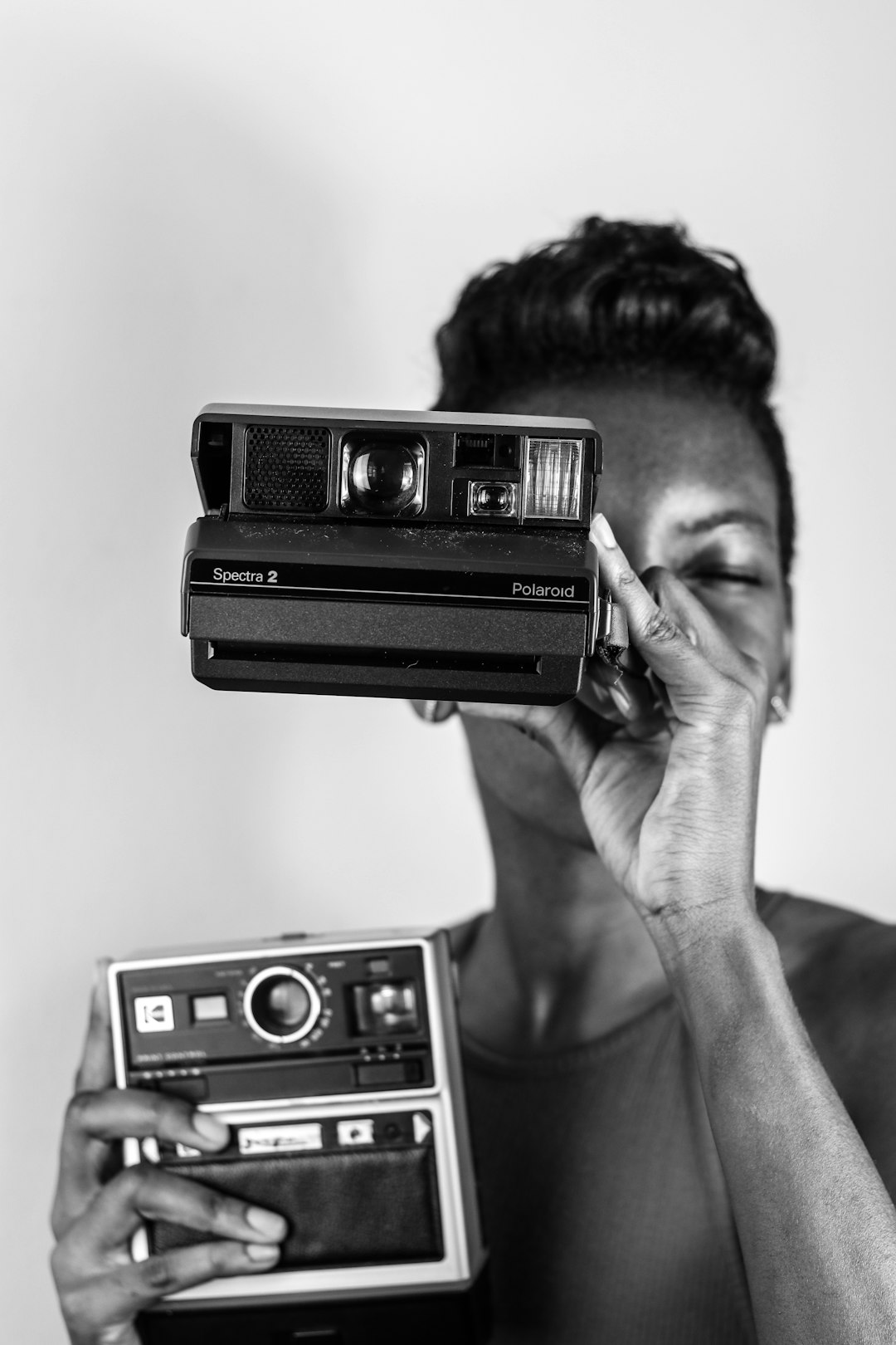 grayscale photo of polaroid camera