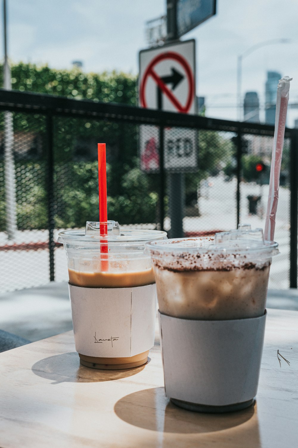 clear plastic cup with brown liquid